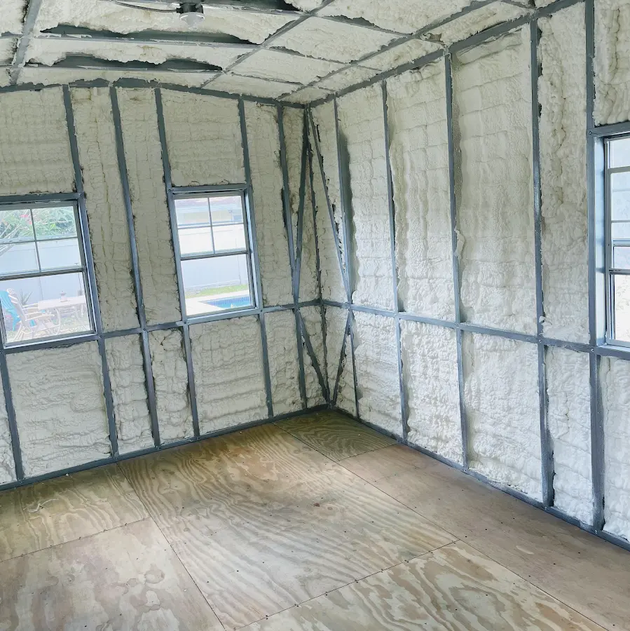 Closed-cell spray foam insulation applied to wall cavities in a residential project in Oxford